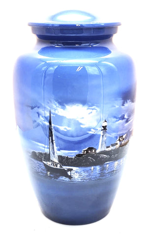 Adult Cremation Urn | Titled "Safe Passage" | Sailboat being guided  by the Lighthouse